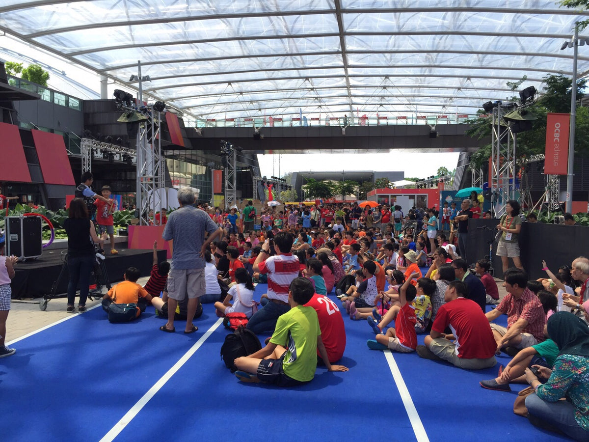 outdoor magic-show performances with children watching and taking part
